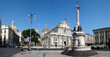 © robertharding - Duomo Square in Catania, Sicily showcases Cathedral of Saint Agatha at sunrise with early risers and empty streets