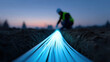 © Nakarin - Glowing fiber optic cables glowing in trench with technician working at dusk, showing modern technology and connection