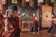 © Travel 'n' Lifestyle - Jakar Dzong, Bhutan - 24 September 2025: View of monks adorned in rich maroon robes engaged in a vibrant, ritualistic dance within the ornately decorated temple walls.