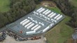 © Liam Carter - Close up aerial view of the Enderby BESS battery energy storage facility in the UK showing CATL units for national grid power supply support.