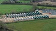 © Liam Carter - Close up aerial view of the Enderby BESS battery energy storage facility in the UK showing CATL units for national grid power supply support.