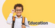 © Prostock-studio - A boy with glasses stands confidently against a yellow background. He adjusts his glasses and holds a backpack, showing readiness for learning at school. This scene represents a typical school day.