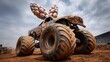 © Ket - Monster truck with colorful egg wings at a muddy arena event
