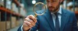 © miss irine - Man in suit inspects boxes in warehouse using magnifying glass. Focus on small details for quality control and inventory management. Precision and thoroughness in logistics operations.