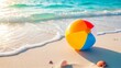 © Enigma - Colorful beach ball resting on sandy shore as gentle ocean waves wash during a sunny summer vacation