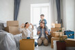 © Serhii - Family celebrating moving day in new home