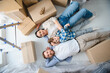 © Serhii - Happy family relaxing on floor in new home