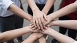© Studicon - Diverse group of people are putting their hands together in a huddle
