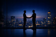 © Panoy - Ultra realistic silhouette of two executives shaking hands in front of full glass skyscraper window,