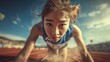 © MarkelovaVision - An Asian female sprinter intensely focuses, poised at the starting line, ready to compete in a track race.