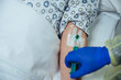 © Westend61 - Close-up of patient in hospital receiving an infusion