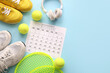 © Pixel-Shot - Composition with paper calendar, headphones, sneakers and tennis rackets on color background