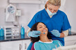 © Rido - Mature dentist making treatment in modern clinic