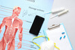 © Pixel-Shot - Mobile phone and medical supplies on light background. Telemedicine concept