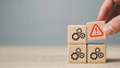 © The KonG - Wooden blocks with gear icons and red warning symbol, System failure, risk management, problem identification, and business process troubleshooting solutions.
