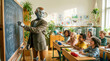 © AdamDiezel - Robot teacher explains mathematics to happy children in a classroom at a chalkboard.