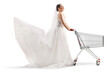 © Ljupco Smokovski - Bride in a wedding dress pushing an empty shopping cart