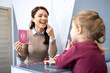 © littlewolf1989 - Speech therapist teaching child articulation and pronunciation using letter flashcard during a speech therapy session, focusing on speech development and language skills