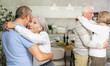 © JackF - Couple dance at a house party in an apartment for elderly friends