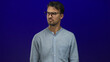 © Krakenimages.com - Young hispanic man in glasses reacts to bad smell over an isolated blue background displaying disgust and annoyance in a candid expression of unpleasant surprise