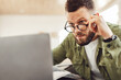 © Prostock-studio - Shocked Freelancer Man Looking At Laptop Above Eyeglasses Reading Overwhelming Online News Having Business Problem Or Bad Sight Sitting Indoor. Technology And Healthcare. Selective Focus, Side View