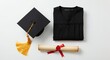 © Creative Canvas - Flat lay of folded graduation gown with cap and scroll on white background