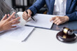 © Charlie's - Lawyer businessman working with lawbook in office or courtroom Legal counsel with gavel and legal law. justice and lawyer concept Judge gavel hammer on Lawyer desk.
