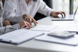 © Charlie's - Auditor or internal revenue service staff, Business women checking annual financial statements of company. Audit Concept.