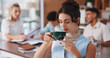 © Flash25/peopleimages.com - Business woman, drinking coffee and meeting in office for creative project and planning. Employees, journalist or person in workplace with caffeine, start day and coworking with cooperation beverage