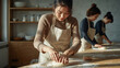 © bephoto - 料理教室で生地を捏ねる日本人女性たちの協働と笑顔を捉える