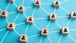 © Hanna - Network of blocks with people icons connected by lines showing relationships and interactions in a system