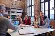 © Westend61 - Business people at a strategy meeting in the office