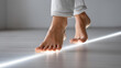 © Nataliya - Bare feet walking carefully on illuminated line, minimalistic style calm atmosphere, balance mindfulness focus, soft lighting indoor close-up, with copy space