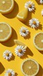 © Ketanoff - Fresh lemon slices and blooming white daisies are arranged on a bright yellow surface. Scattered white pearls complement the cheerful still life composition, illuminated by daylight