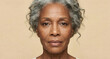 © Oksana Klymenko - Close up portrait of a african american senior woman, showing deep wrinkles. Aging skin care for the face and eyes. Focusing on skin health. Beauty, anti-aging cosmetics.