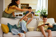 © djile - Mother confiscating controller while children playing video game