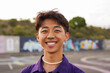 © Sabrina - Happy young asian man with make up smiling in front of camera outdoor - LGBT, gay person and generation z concept