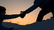 © Victoriia - Travelers climb mountain together. Climbers, holding hands, climb to top of hill. Silhouettes. Teamwork business people. Reach your goal. Victory of business team. Lend helping hand, partner. Travel