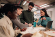 © Zamrznuti tonovi - Diverse business team collaborating during office meeting