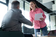 © opolja - Handshake of happy young business woman and mature business man at office meeting