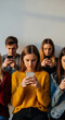 © Inspire Shots Hub - A group of focused young individuals look at their mobile phone, representative of modern communication, socialization, and technology dependence