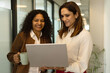 © Pix4Ads - Two indian business woman working on laptop computer, Business partners Working together on project.. Corporate women working together while standing at office.