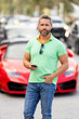 © Volodymyr - Mature man using smartphone on city street near car. Middle aged man outdoors with phone. Casual urban lifestyle portrait with cars in summer city. Traveler with mobile phone on travel journey.