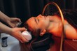 © Roman - Woman receiving head spa and scalp treatment. Japanese spa head