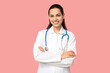 © Pixel-Shot - Portrait of young female doctor with stethoscope on pink background