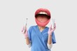© Pixel-Shot - Female dentist with mouth instead of head holding electric tooth brush and paste on light background