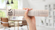 © Pixel-Shot - Female hand and newspaper on white background