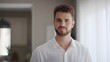 © decorator - Confident man smiles warmly in modern home lifestyle portrait evoking approachable authenticity