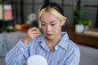 © Charlie's - Daily beauty routine Asian woman self care doing gua sha facial massage Traditional medicine Gua Sha quartz stone Cosmetic natural trend.