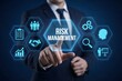 © mainul19islam - Risk management concept with business leader touching virtual compliance icons